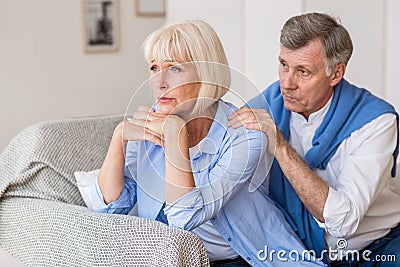 Relationship problems. Senior man consoling wife after quarrel Stock Photo