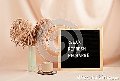 Relax, refresh, recharge, motivational quote on letter board Stock Photo