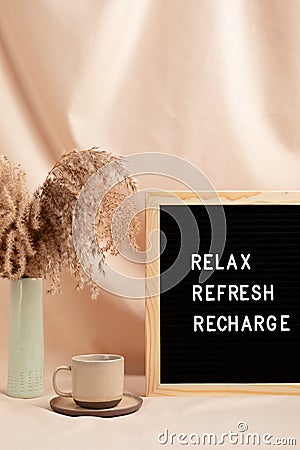 Relax, refresh, recharge, motivational quote on letter board Stock Photo