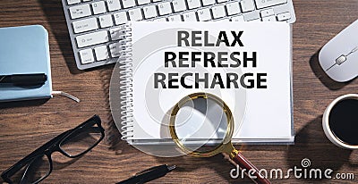 Relax, Refresh, Recharge on notepad Stock Photo