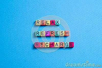 Relax,Refresh,Recharhe - word concept on cubes, text Stock Photo