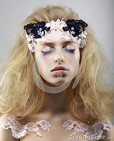 Relax. Styled Enigmatic Blonde with Painted Skin. Dreams with Closed Eyes. Beauty Stock Photo