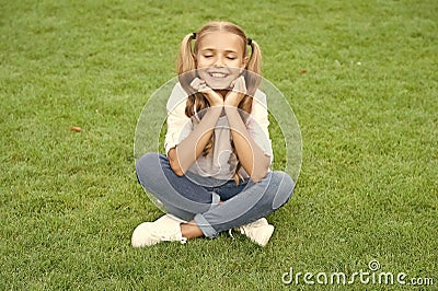 relax on summer lawn. girl relax peacefully on the grass. happy childhood of teen girl. summer relax in park. teen girl Stock Photo