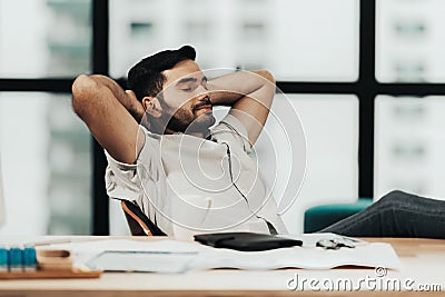 Relax time. Successful Businessman relaxing and resting after sitting and hard working in modern office. Stock Photo