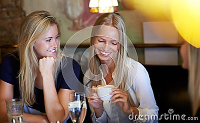 Relax, women and coffee shop with conversation, smile and cheerful with weekend break, social gathering and talking Stock Photo