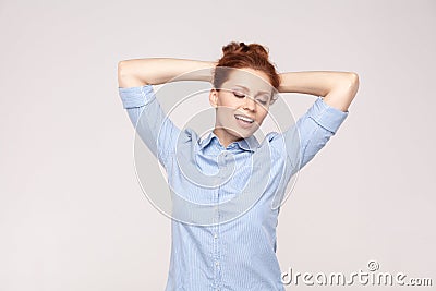 Relaxation concept. Happiness and beautiful ginger lady, holding Stock Photo