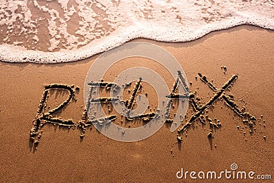 Relaxation Concept, Relax Word Written on Summer Sand Beach with Stock Photo