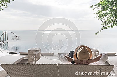 Relaxation holiday vacation, work-life balance of businessman take it easy happily resting on beach chair Stock Photo