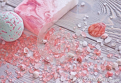 Relaxation and treatment background with bath bomb,handmade soap bar,seashells and aromatherapy salt. Stock Photo