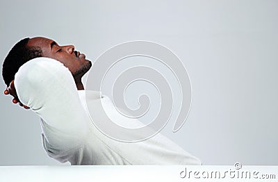 Relaxed african man sleaping at his workplace Stock Photo