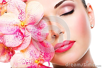 Relaxed beautiful face of a young girl with clear skin and pink