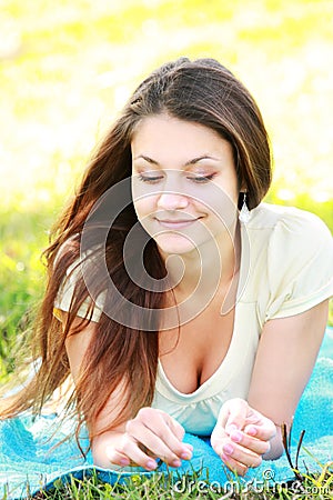 Relaxed brunette outdoors Stock Photo