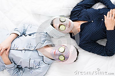 Attractive best friends relaxing during a sleepover Stock Photo