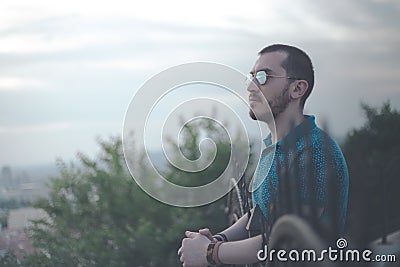 Relaxed and calm man looking to sky in a peaceful mood Stock Photo