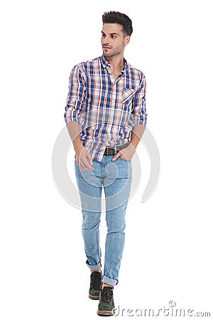 Relaxed casual man walking and looking to side Stock Photo