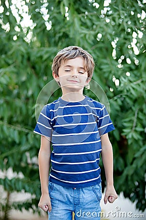 Relaxed child with closed eyes dreaming Stock Photo