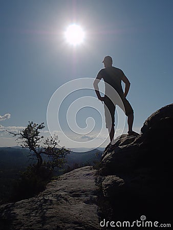 Relaxed man watching dreamfully spectacular hilly range Stock Photo