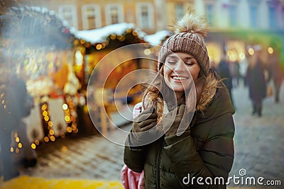 relaxed modern 40 years old woman at winter fair in city Stock Photo