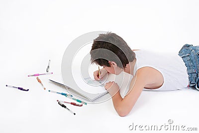 Relaxed schoolboy drawing Stock Photo