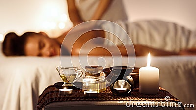 Relaxed woman enjoying aromatherapy massage in luxury spa Stock Photo