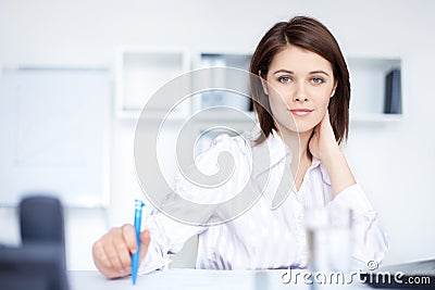 Relaxed young business woman woman in office Stock Photo