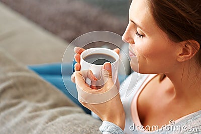 relaxed-young-lady-enjoying-cup-black-coffee-15743194.jpg