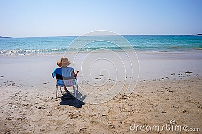 Relaxing on the beach and enjoying the seascape at ALanzada, Spain Stock Photo