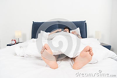 Relaxing in bedroom. Sweet dreams. asleep and awake. male in bed. man sleep in morning. energy and tiredness. sleepy man Stock Photo