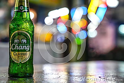 Relaxing with a bottle of beer from a busy schedule Editorial Stock Photo