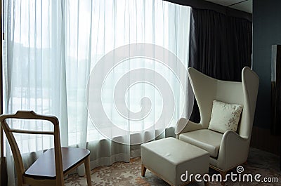 Relaxing corner armchair in hotel accommodation bedroom Stock Photo