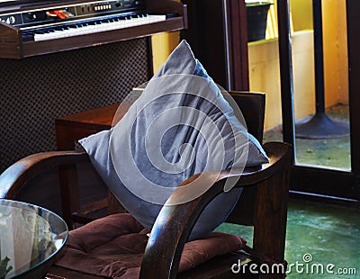 Relaxing corner of the wooden chair in the room Stock Photo