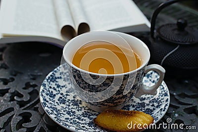 Relaxing cup of green jazmin tea at the porch. Porcelain cuppa. Stock Photo