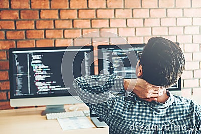 Relaxing Developing programmer Development Website design and coding technologies working in software company office Stock Photo