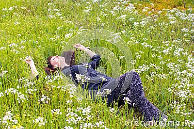 Woman relaxing flower field Stock Photo
