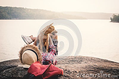 Relaxing moment Asian boy and dog in nature Stock Photo