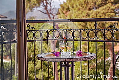 Relaxing summer cocktails and surreal flowers of bougainvillea in front of Turkey flag, mountains and trees. Travel Stock Photo