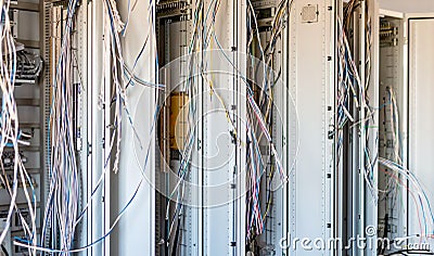 Relay hall with a variety of wires in the process of installation Stock Photo