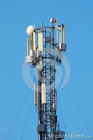 Relay tower with many antennas against the sky Stock Photo