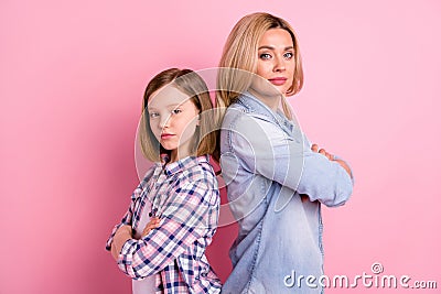 Reliable family team workers mother daughter stand back to back cross hands ready solve decision solution wear denim Stock Photo