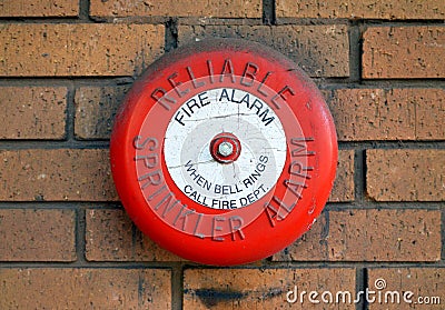 Reliable Sprinkler Fire Alarm Bell on a Brick Wall Editorial Stock Photo