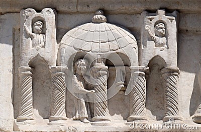 Relief above the portal San Salvatore church in Lucca, Italy Stock Photo