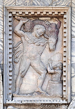 Relief depicting Hercules and the Erymanthian boar, facade detail of St. Mark`s Basilica, Venice, Italy Stock Photo