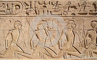 Relief depicting a row of captives in Abu Simbel temple of Ramesses II, Egypt Stock Photo