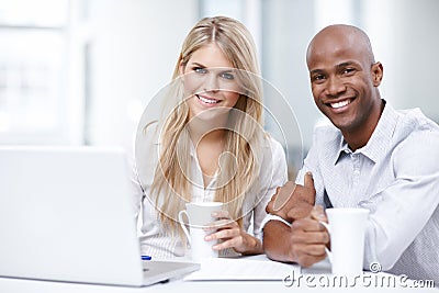 Relief after meeting a deadline. Portrait of two young businesspeople working together on a project. Stock Photo