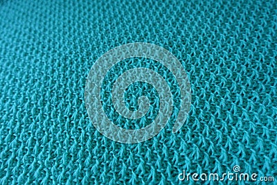 Relief stitches on motton blue handmade knitwork Stock Photo