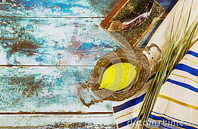 Religion jewish celebration holiday Sukkot. Etrog, lulav, hadas arava kippah and shofar tallit praying book Stock Photo