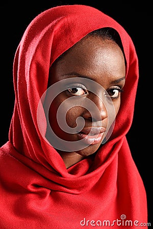 Religious african muslim woman in red headscarf Stock Photo