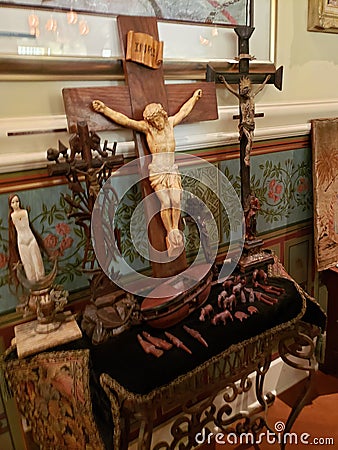 Religious altar cross and artifacts Stock Photo