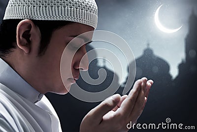 Religious asian muslim man pray Stock Photo