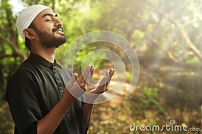 Religious asian muslim man pray Stock Photo